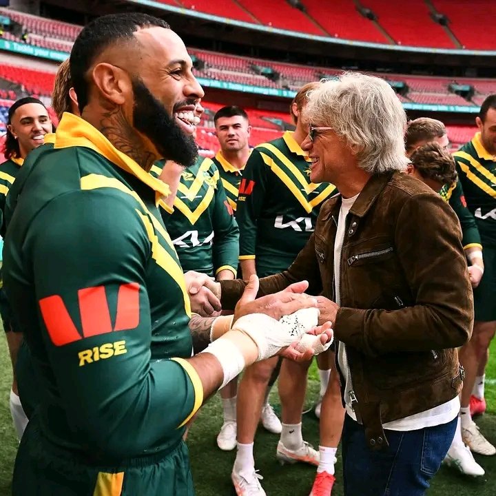 🎤🏉🌟 UNBELIEVABLE SCENES AT WEMBLEY! Parramatta-bound superstar Josh Addo-Carr steals the spotlight — spotted rocking out with none other than music legend Jon Bon Jovi at Wembley Stadium! 🤯🔥 Fans are LOSING IT online as the Foxx and the rock icon share laughs, selfies, and stage vibes before Bon Jovi’s electric performance. 🎸⚡ The moment screams energy, fame, and charisma — two showmen from different worlds colliding under the Wembley lights. 💥 “Livin’ on a Prayer” meets “The Foxx on Fire”! 🦊🎶